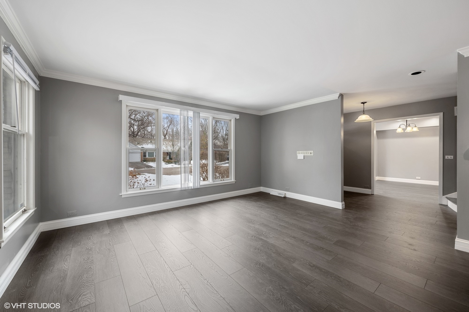 643 Robin Lane Glencoe, IL 60022 - Photo 6 of 32 a view of an empty room with wooden floor and a window
