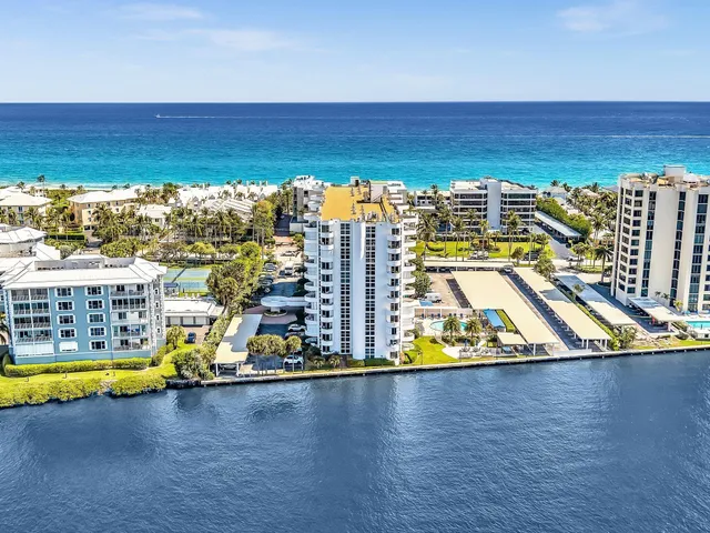 a large kitchen with stainless steel appliances granite countertop a lot of counter space and wooden floors
