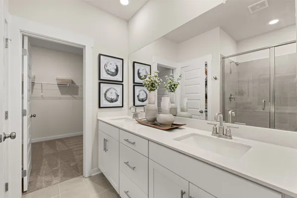 a bathroom with a sink and shower