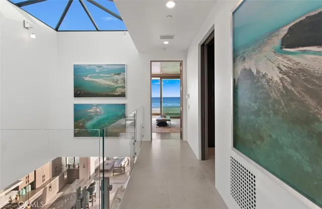 a hallway with a dining table and chairs