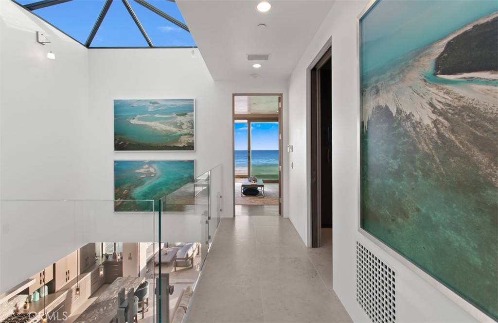 35461 Beach Road Dana Point, CA 92624 - Photo 17 of 46 a hallway with a dining table and chairs