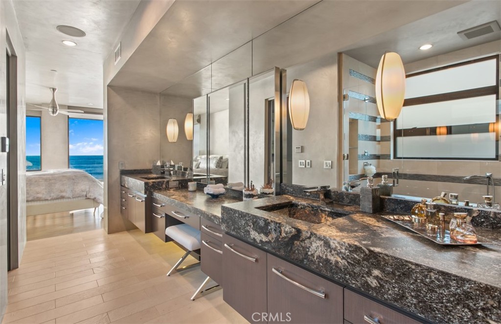 35461 Beach Road Dana Point, CA 92624 - Photo 23 of 46 a bathroom with a granite countertop sink and a mirror