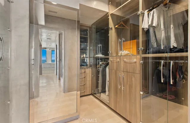 a view of a hallway with paintings on the wall