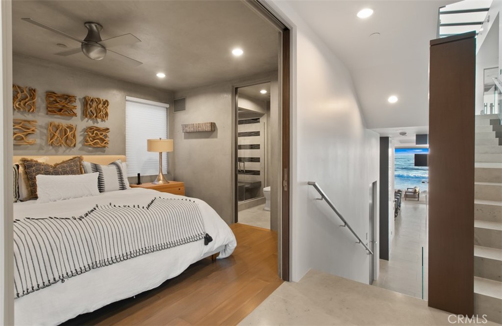 35461 Beach Road Dana Point, CA 92624 - Photo 28 of 46 a spacious bedroom with a bed and a walk in closet