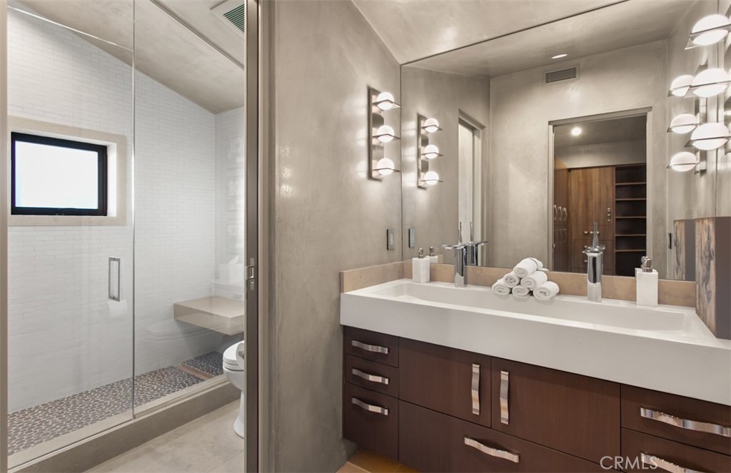 35461 Beach Road Dana Point, CA 92624 - Photo 30 of 46 a bathroom with a sink a toilet and shower