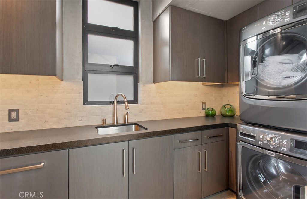 35461 Beach Road Dana Point, CA 92624 - Photo 38 of 46 a kitchen with a sink and cabinets