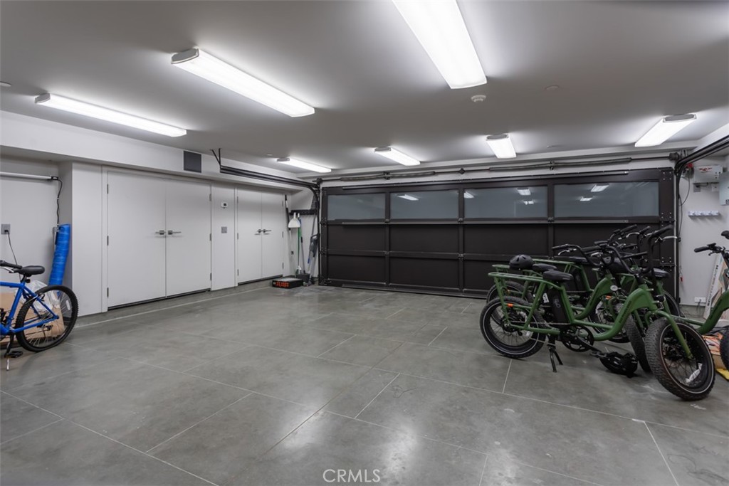 35461 Beach Road Dana Point, CA 92624 - Photo 44 of 46 a view of a garage with a bike and a car