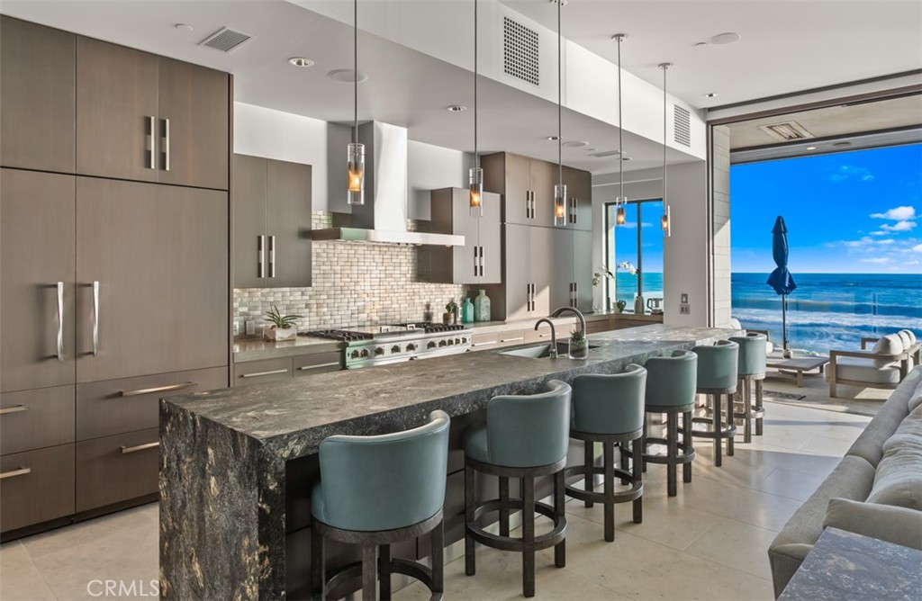 35461 Beach Road Dana Point, CA 92624 - Photo 5 of 46 a kitchen with center island table and chairs