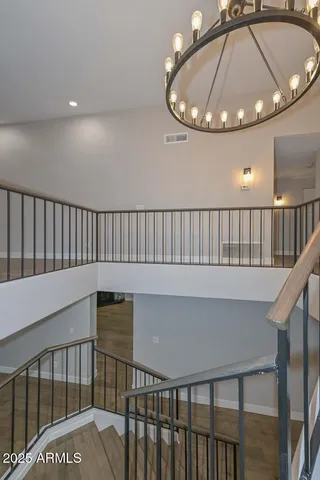 a view of a hallway view with a chandelier
