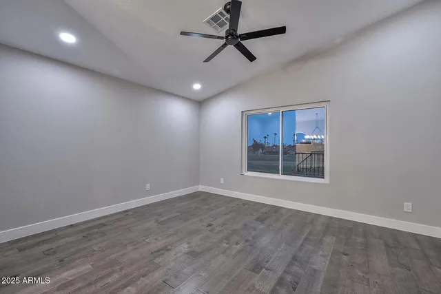 a view of livingroom with hardwood floor and a ceiling fan