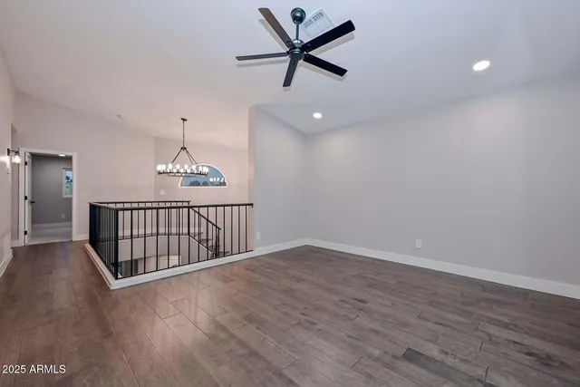 a spacious bedroom with a bed and a fireplace