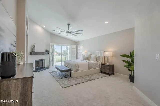 a bedroom with a large bed and a window