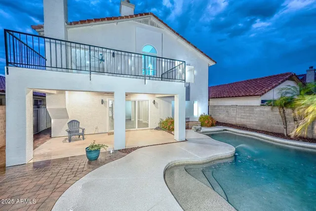 a view of balcony with wooden floor and fence