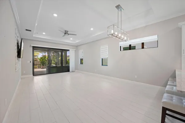 a view of an empty room with glass door