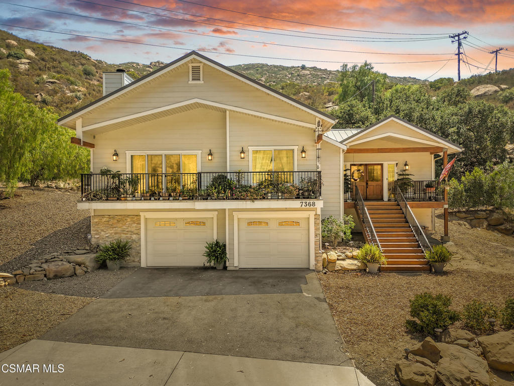 7368 Santa Susana Pass Road Simi Valley, CA 93063 - Photo 1 of 48 a view of a white house with a yard