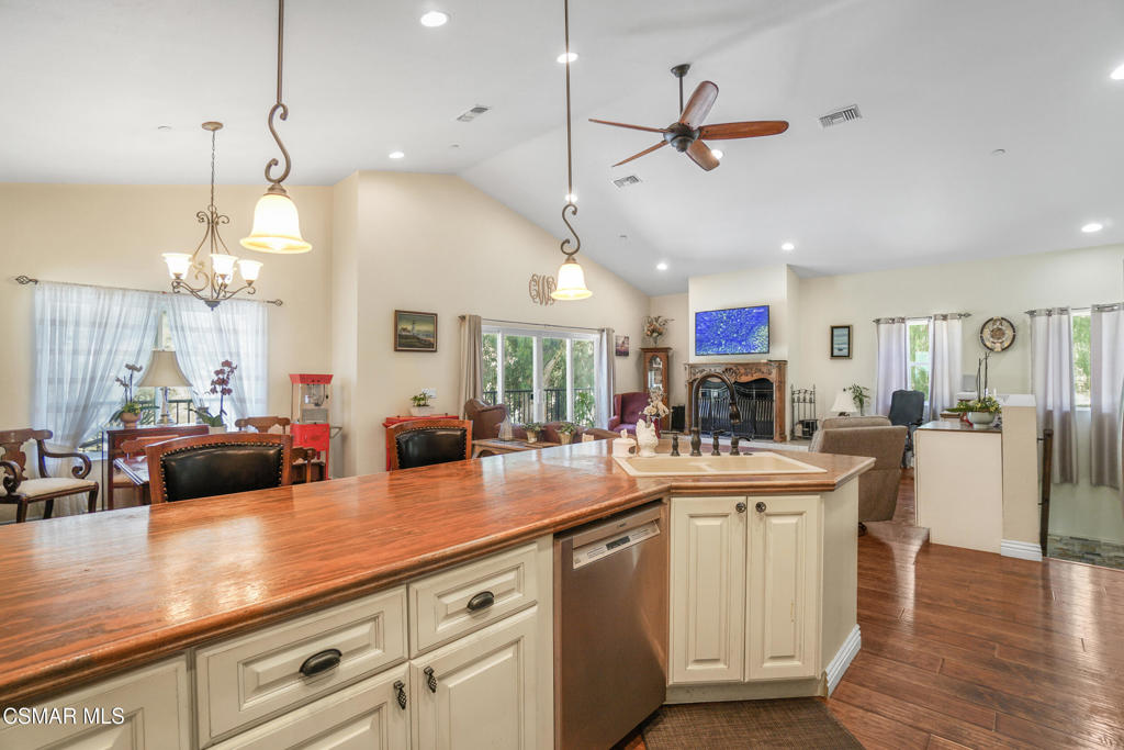 7368 Santa Susana Pass Road Simi Valley, CA 93063 - Photo 13 of 48 a kitchen with stainless steel appliances kitchen island a large island in the center