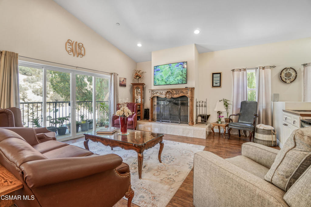 7368 Santa Susana Pass Road Simi Valley, CA 93063 - Photo 14 of 48 a living room with furniture large window and a flat screen tv