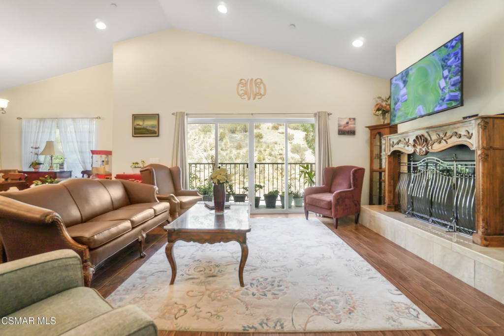 7368 Santa Susana Pass Road Simi Valley, CA 93063 - Photo 15 of 48 a living room with furniture and a flat screen tv