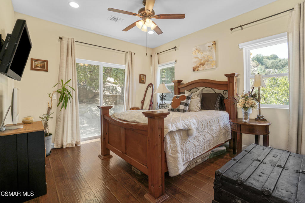 7368 Santa Susana Pass Road Simi Valley, CA 93063 - Photo 27 of 48 a bed room with a bed and a flat tv screen