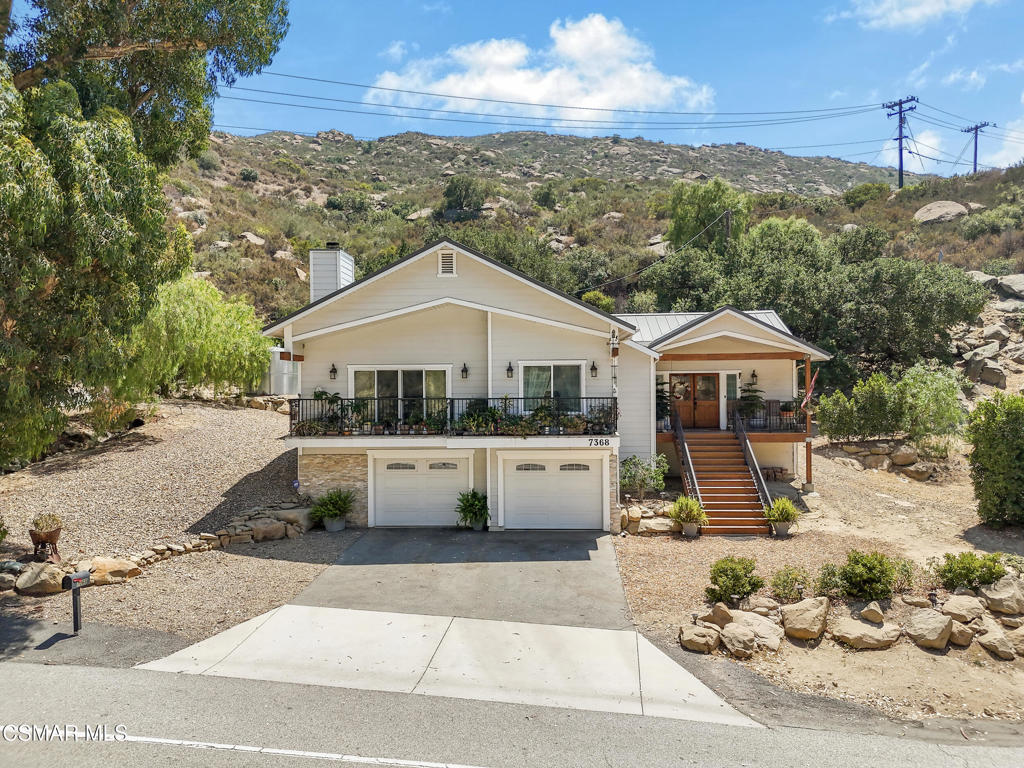 7368 Santa Susana Pass Road Simi Valley, CA 93063 - Photo 3 of 48 a front view of a house with a yard