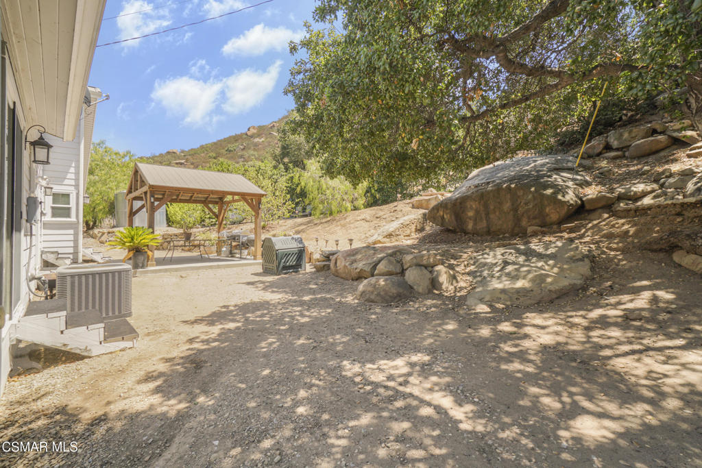 7368 Santa Susana Pass Road Simi Valley, CA 93063 - Photo 33 of 48 a view of road with large trees