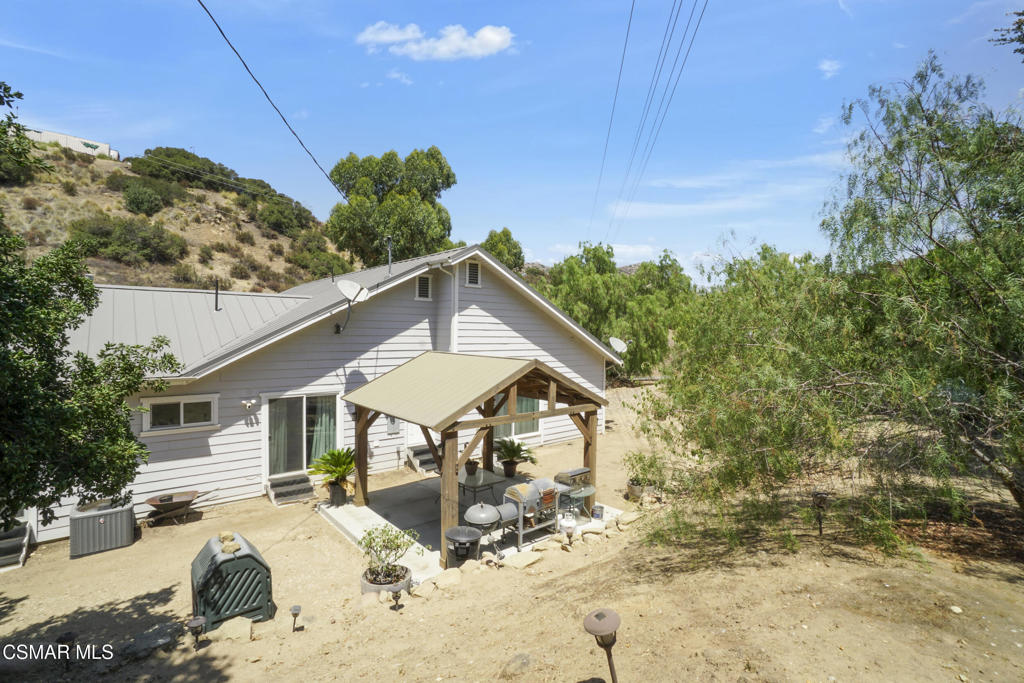 7368 Santa Susana Pass Road Simi Valley, CA 93063 - Photo 36 of 48 a front view of a house with a yard