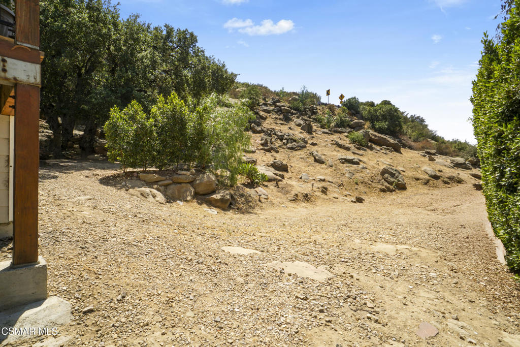 7368 Santa Susana Pass Road Simi Valley, CA 93063 - Photo 38 of 48 a view of a yard with a snow on the road