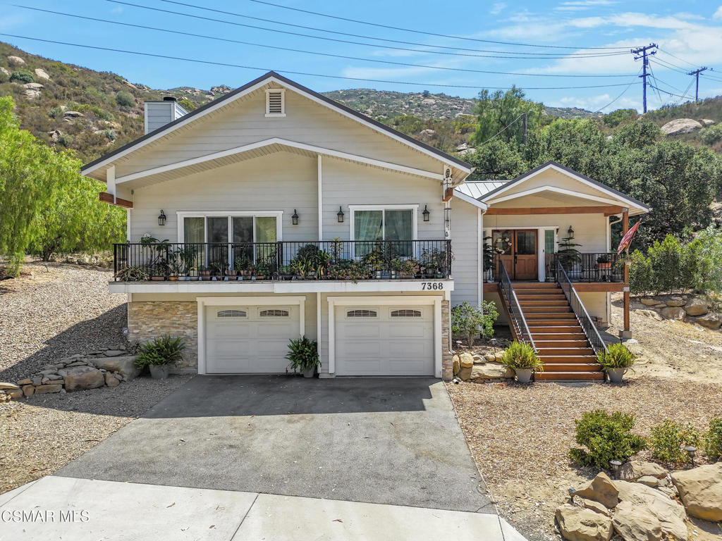 7368 Santa Susana Pass Road Simi Valley, CA 93063 - Photo 4 of 48 a front view of a house with garden