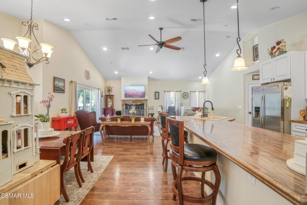 7368 Santa Susana Pass Road Simi Valley, CA 93063 - Photo 9 of 48 a living room with lots of furniture and a chandelier