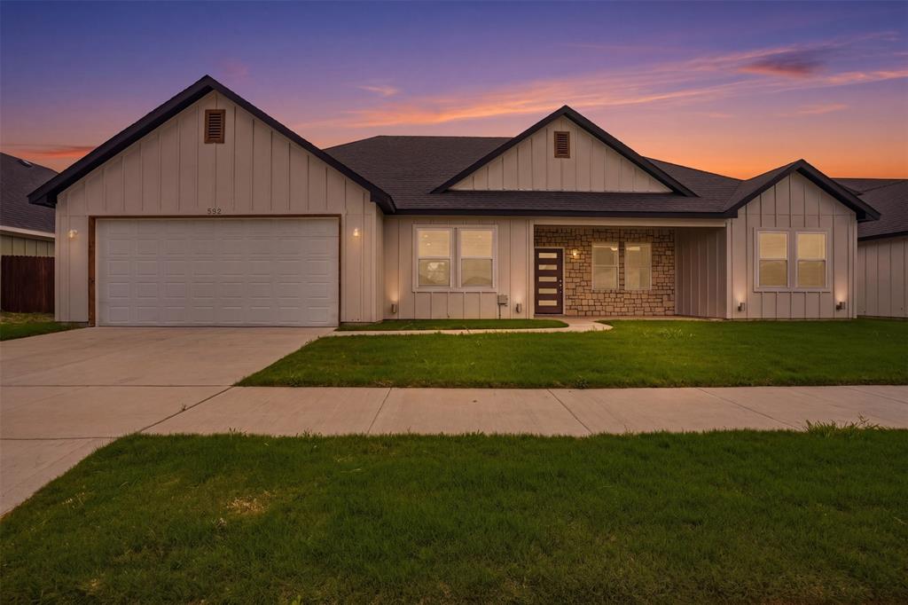 532 Highview Court Godley, TX 76044 - Photo 1 of 39 Modern exterior featuring board and batten siding, stone accents, and a covered entry