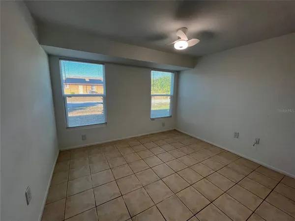 a view of an empty room and window