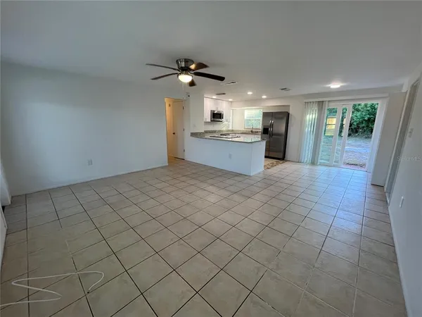 a view of a kitchen and microwave