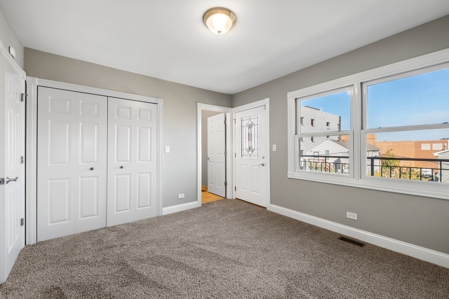 2340 West Adams Street, Unit 33 Chicago, IL 60612 - Photo 14 of 17 a view of an empty room with a window