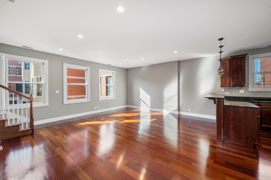 2340 West Adams Street, Unit 33 Chicago, IL 60612 - Photo 4 of 17 a view of livingroom with hardwood floor and window