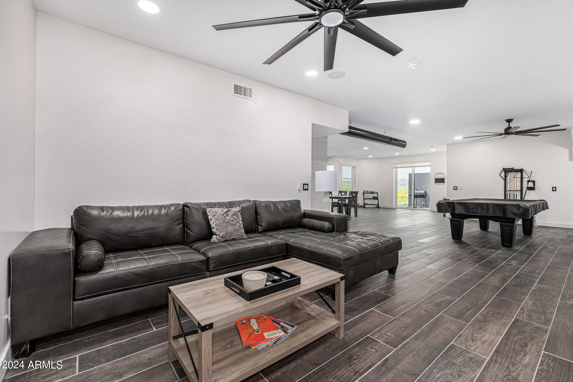1829 West Cloud Road Phoenix, AZ 85086 - Photo 63 of 137 a living room with furniture and a dining table with wooden floor