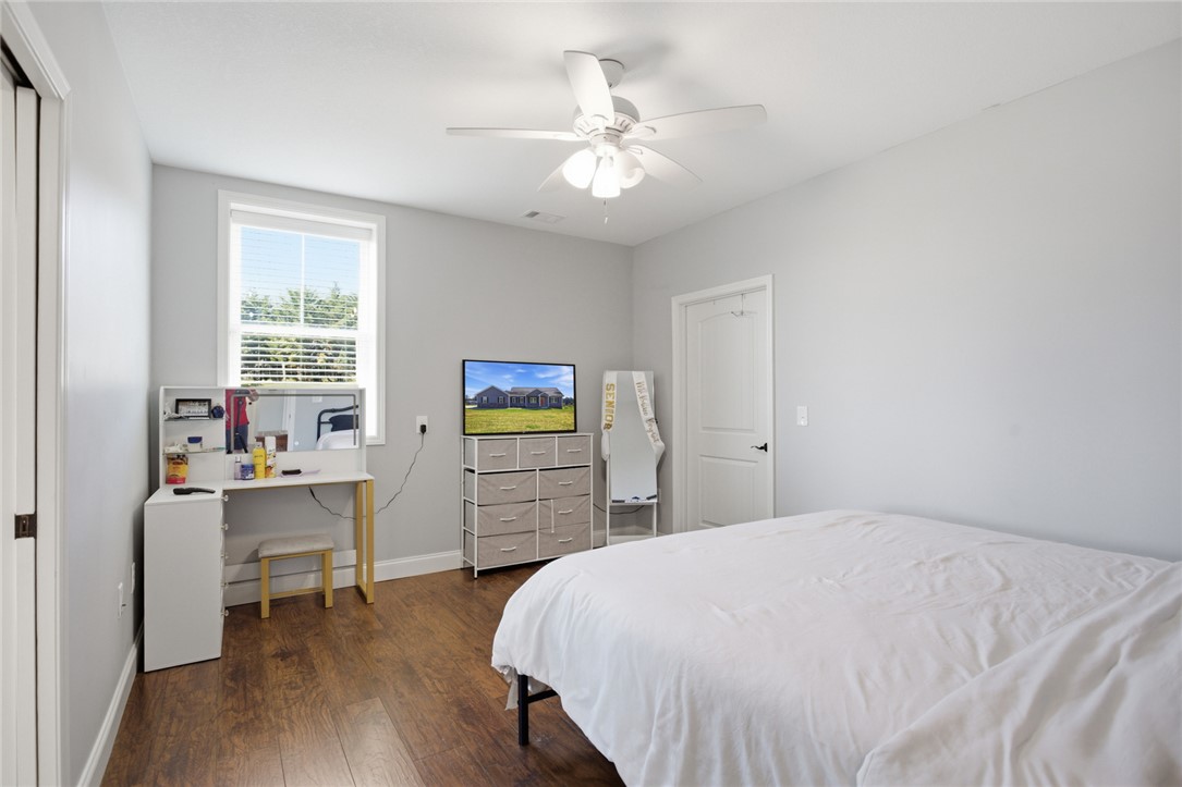426 Oak Creek Road Seneca, SC 29678 - Photo 22 of 50 This spacious bedroom offers ample natural light and comfortable wood flooring.