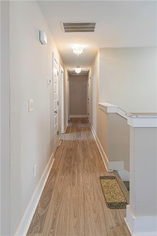 3336 Donna Way Gainesville, GA 30504 - Photo 11 of 30 a view of a hallway with wooden floor and staircase