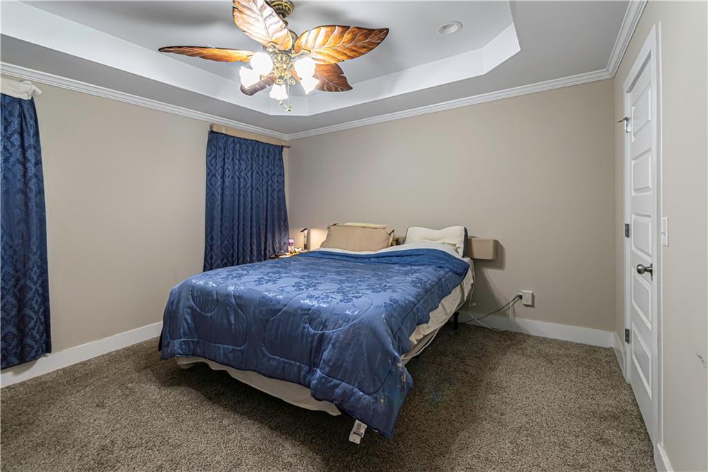 3336 Donna Way Gainesville, GA 30504 - Photo 12 of 30 a spacious bedroom with a bed and a chandelier