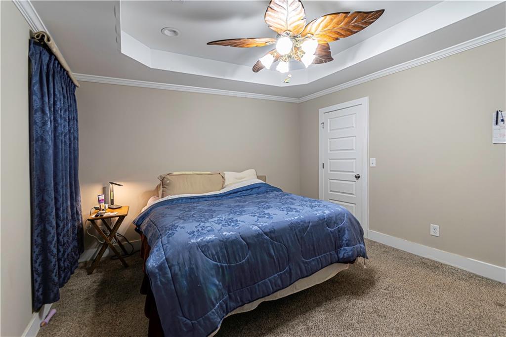 3336 Donna Way Gainesville, GA 30504 - Photo 13 of 30 a bedroom with a bed and a chandelier