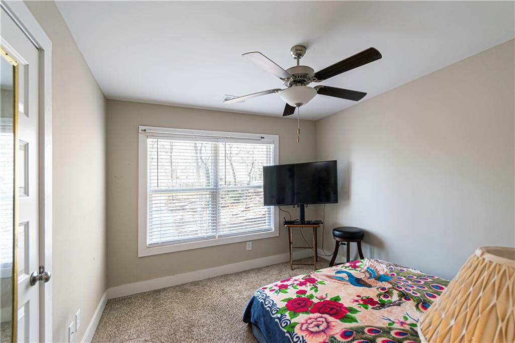 3336 Donna Way Gainesville, GA 30504 - Photo 15 of 30 a bedroom with a bed and a flat screen tv