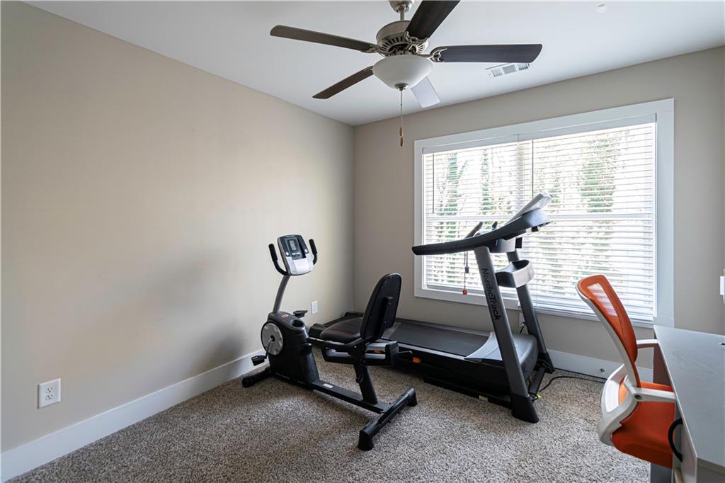 3336 Donna Way Gainesville, GA 30504 - Photo 19 of 30 a room with gym equipment and windows