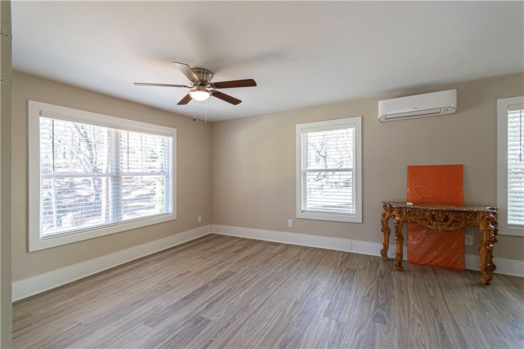 3336 Donna Way Gainesville, GA 30504 - Photo 20 of 30 a view of a livingroom with furniture a ceiling fan and wooden floor