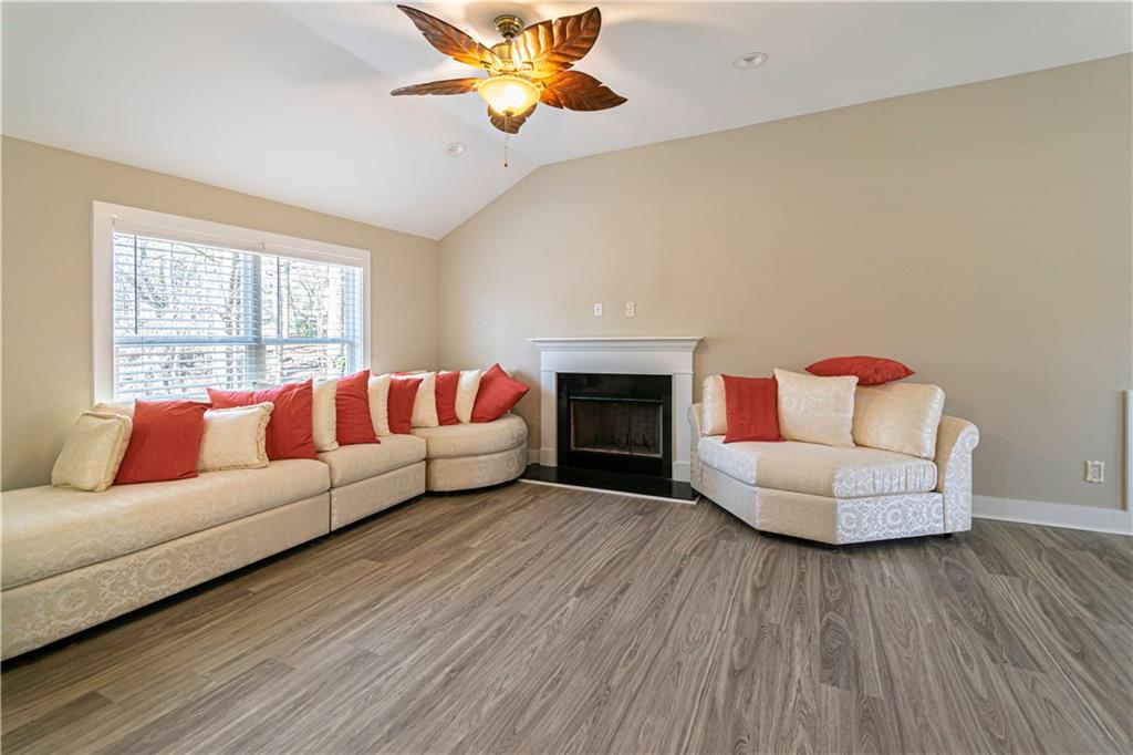 3336 Donna Way Gainesville, GA 30504 - Photo 4 of 30 a living room with furniture and a fireplace