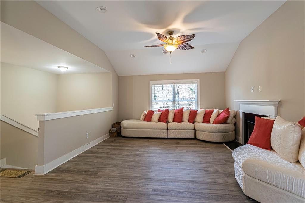 3336 Donna Way Gainesville, GA 30504 - Photo 5 of 30 a living room with furniture and a chandelier