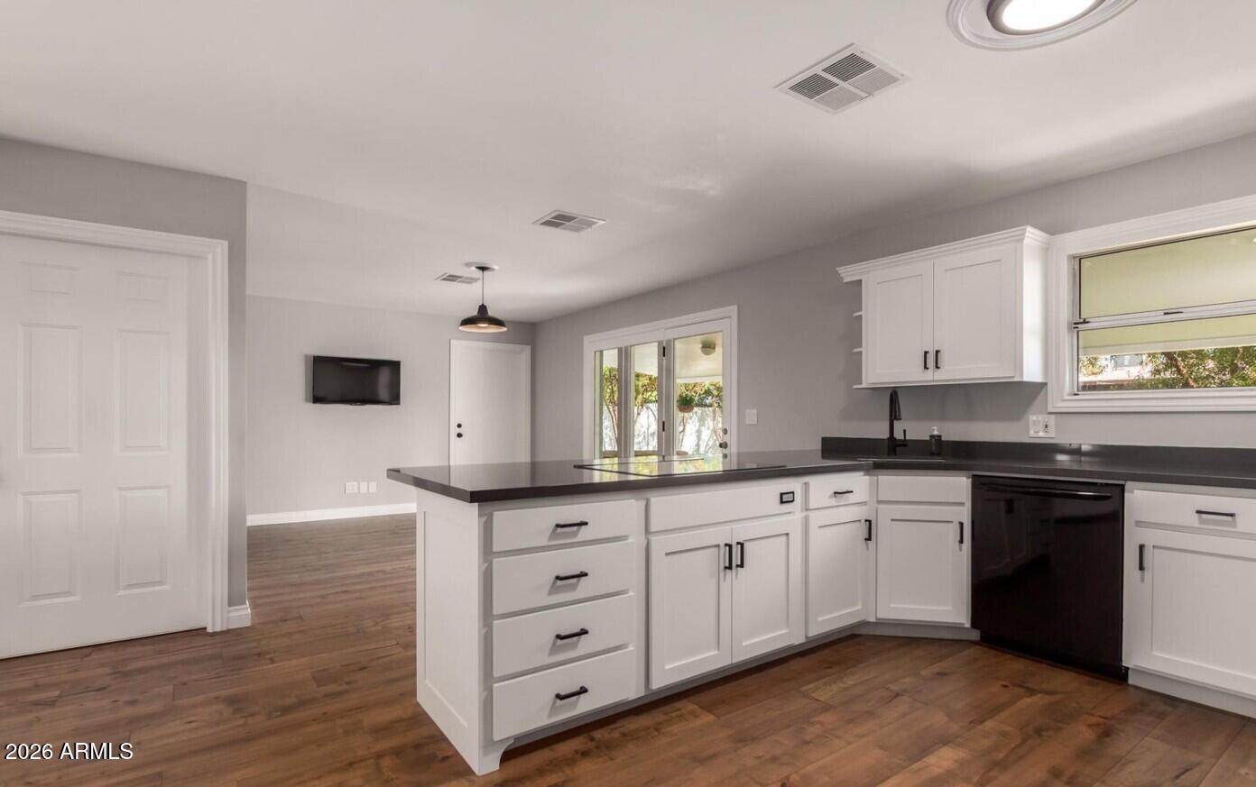 607 West 15th Street Tempe, AZ 85281 - Photo 7 of 29 a kitchen with granite countertop a sink and cabinets