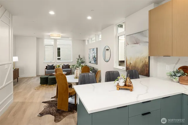 a view of a dining room kitchen with a table chairs and a refrigerator