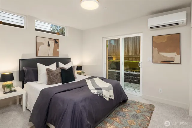 a bedroom with a large bed and a window