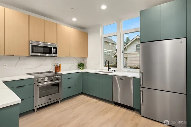 a kitchen with a refrigerator and a sink