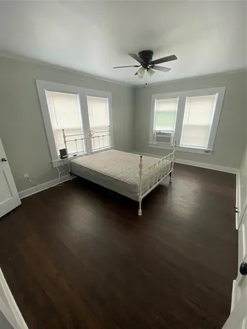 a bed room with a bed furniture and a window