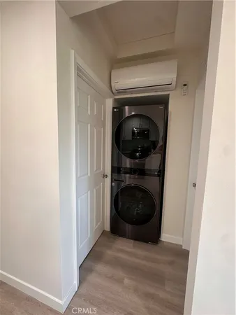 a view of a hallway with washer and dryer
